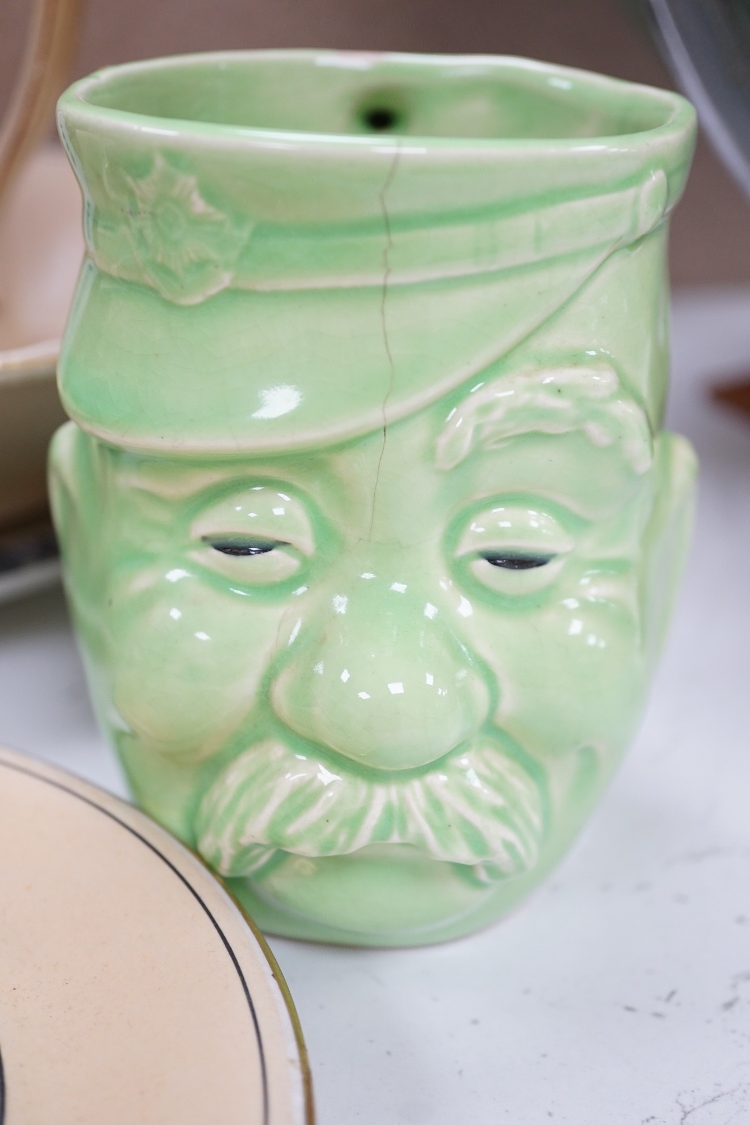 WWI commemorative Grimwades ‘Old Bill’ ceramics, including a jug, a bowl, five various dishes and a moustache cup and saucer, together with two novelty character jugs and a spy card game